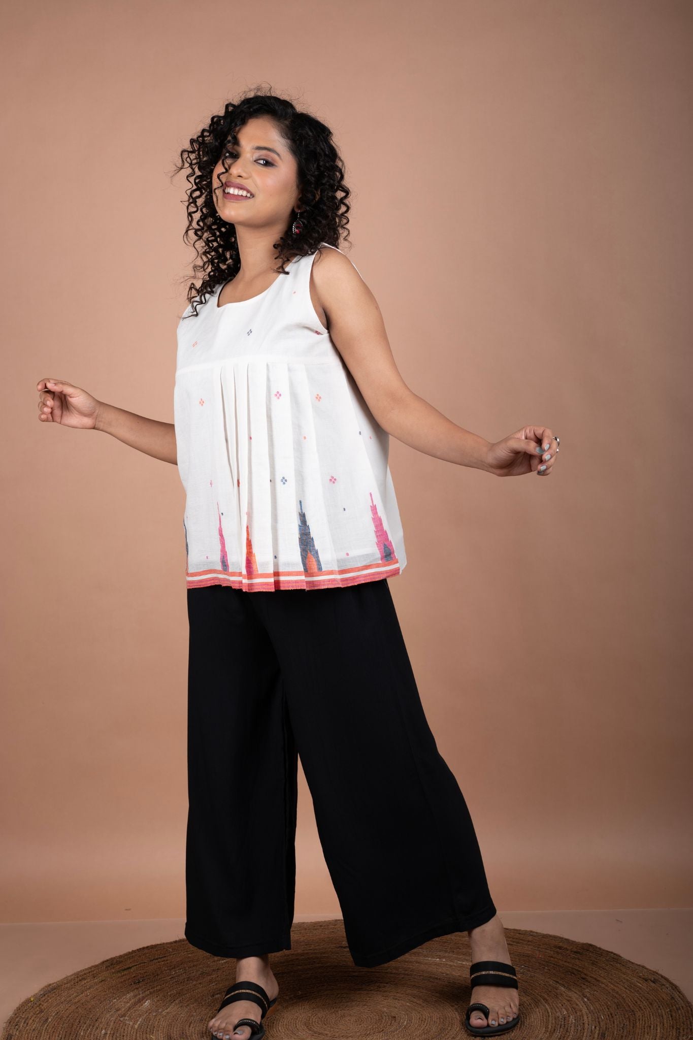 Minimalistic Sleeveless White Jamdani Cotton Top with Temple Border