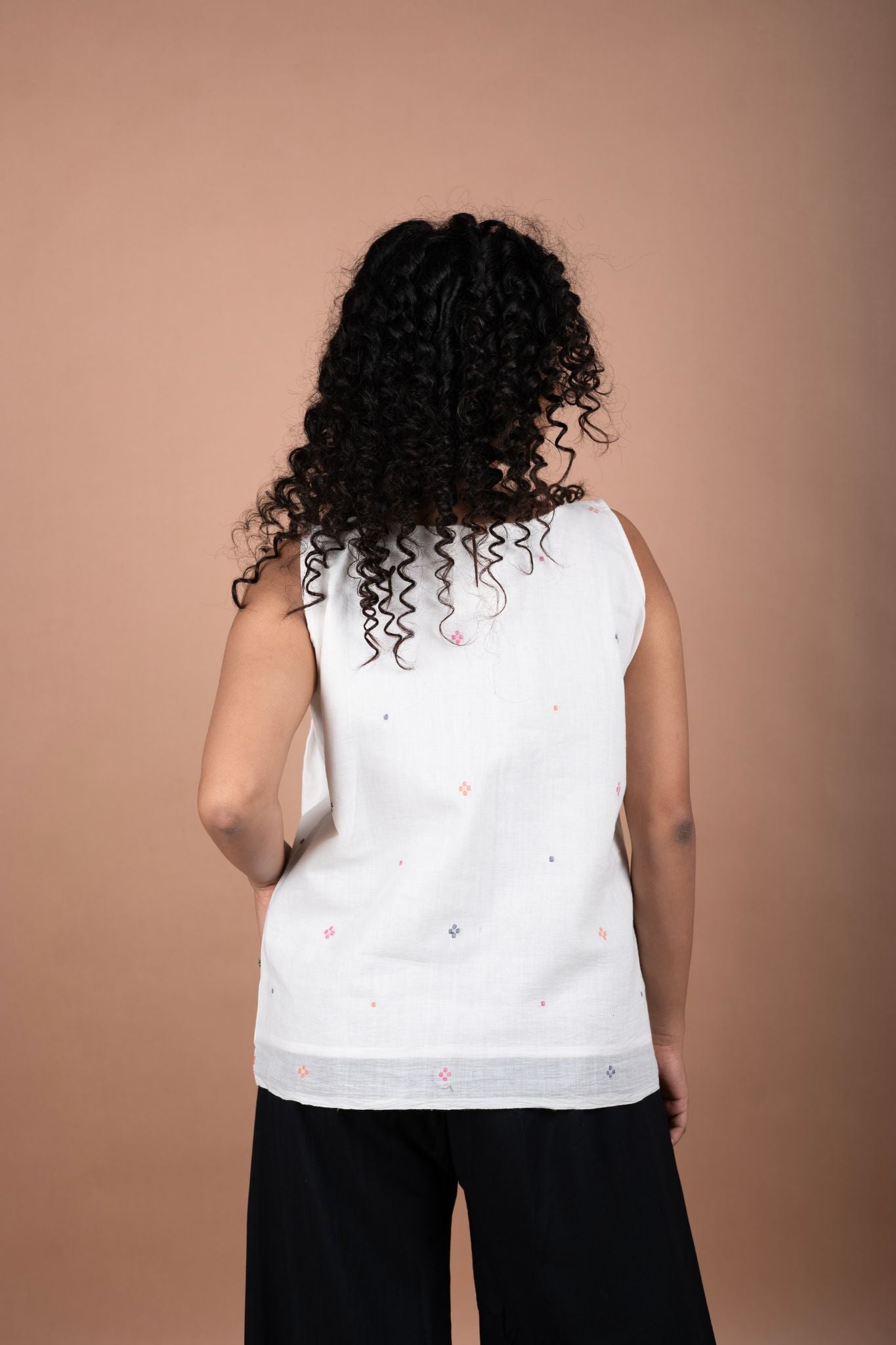 Minimalistic Sleeveless White Jamdani Cotton Top with Temple Border