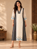 Black and white Jamdani cotton midi dress with vertical striped panels, colourful woven motifs and a V-neckline.