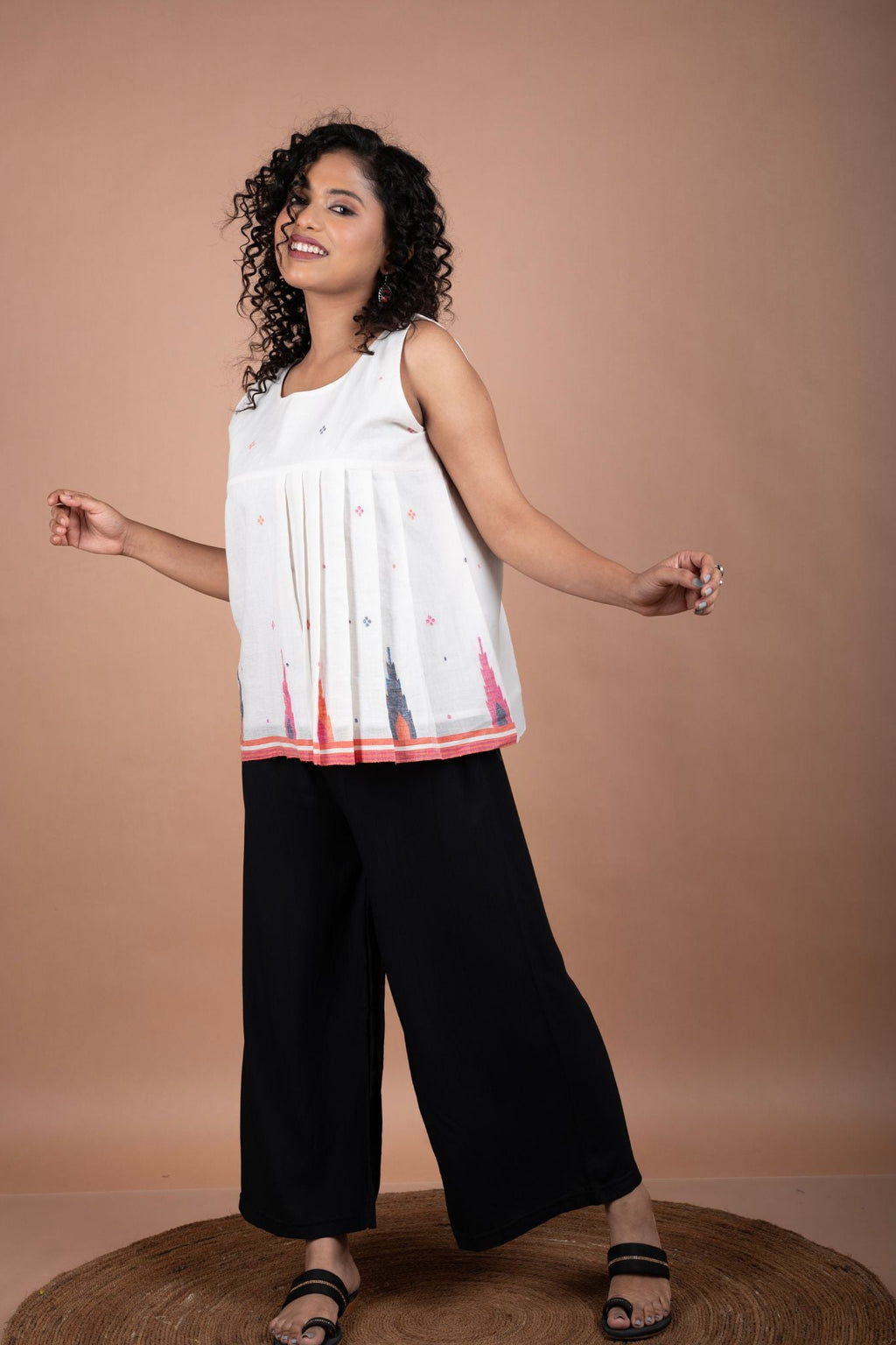 Minimalistic Sleeveless White Jamdani Cotton Top with Temple Border