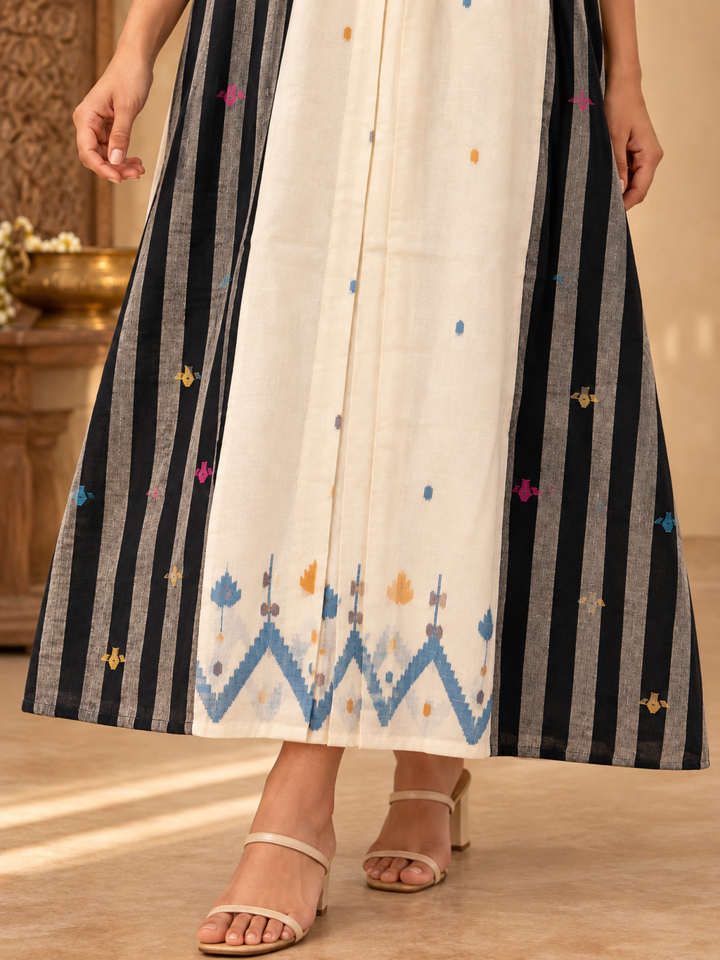Black and white Jamdani cotton midi dress with vertical striped panels, colourful woven motifs and a V-neckline.