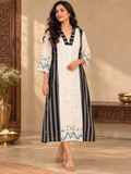 Black and white Jamdani cotton midi dress with vertical striped panels, colourful woven motifs and a V-neckline.